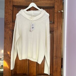 New with tags cream color sweater size Medium.